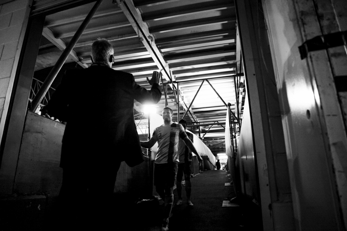 Victorious Socceroos captain Lucas Neill walks down the players tunnel about to be congratulated by FFA Chief Executive David Gallop at the conclusion of the FIFA World Cup Qualifying match between Australia Vs Jordan at Docklands stadium, Melbourne, Australia. By Asanka Brendon Ratnayake