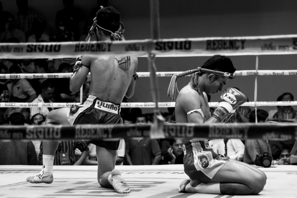 Two fighters pray before the fight starts during a Muay Thai at Chang 7