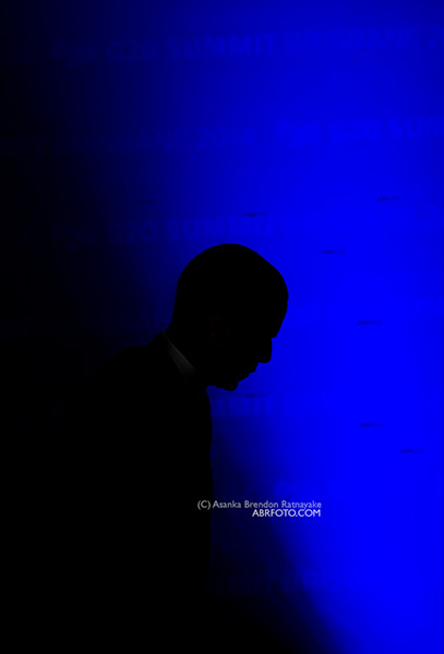 President Barack Obama (silhouette) walks off the stage at the conclusion of his final press conference at the Brisbane Convention and Exhibition Centre in Brisbane at the conclusion of the g20 Leaders Summit.  (c) Asanka Brendon Ratnayake all right reserved