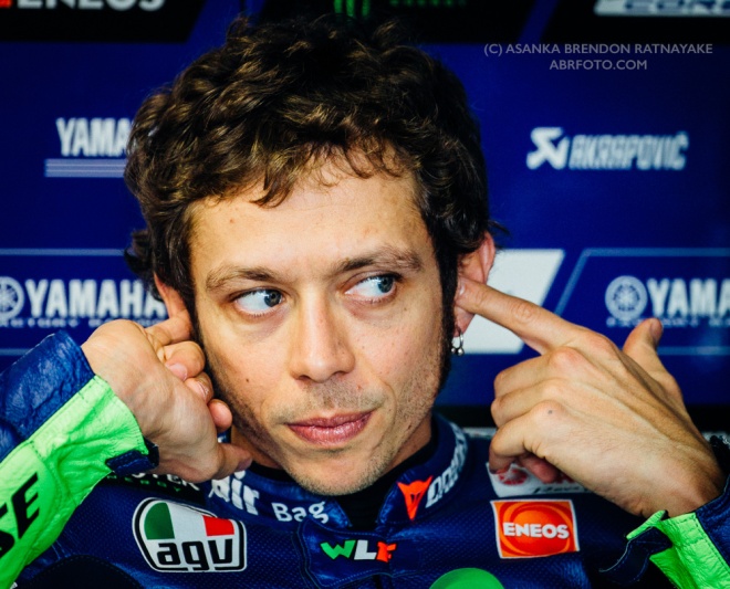 PHILLIP ISLAND, AUSTRALIA - OCTOBER 16 : Valentino Rossi (ITA) of Movistar Yamaha MotoGP places his ear plug into his ear while he sits in his garage during MotoGP free practice of the 2015 MotoGP of Australia Phillip Island Grand Prix Circuit . Phillip Island, Australia October 16 2015.